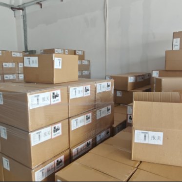 Finished goods cartons stacked in the BJYP warehouse
