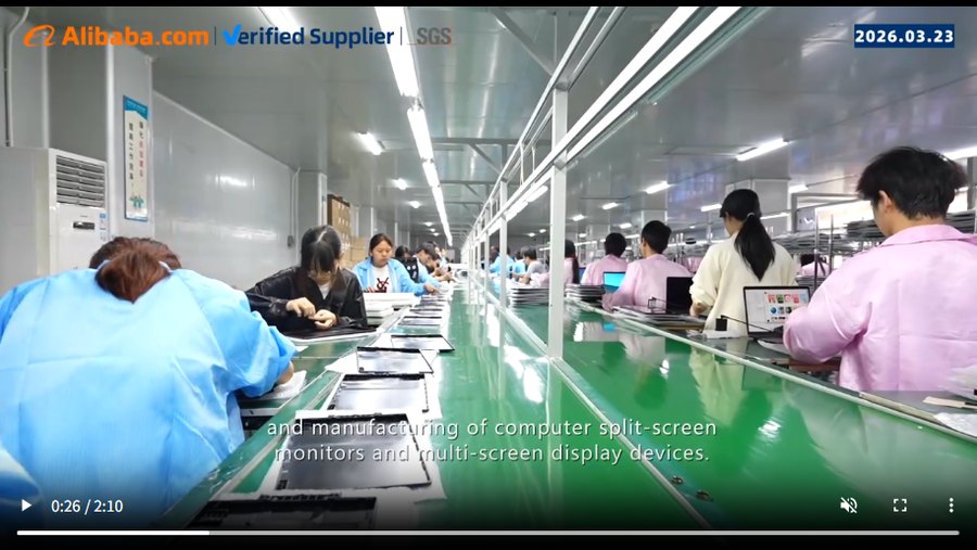Still from the audit film: rows of assemblers working along the BJYP production line